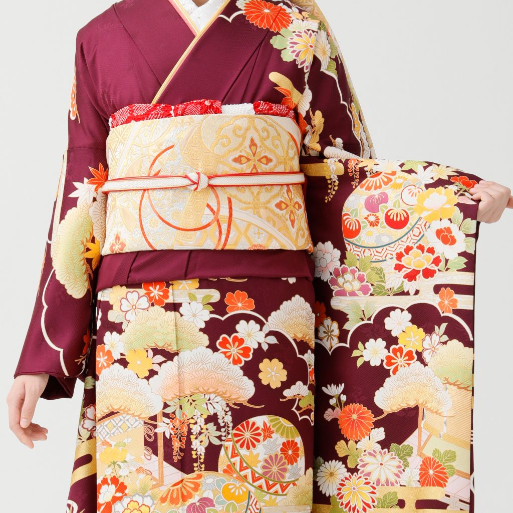 志染庵の紫色の振袖。左袖を広げたコーディネートアップ写真。白に金糸の袋帯がメインの写真。